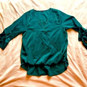 Tie sleeeves and wrap-style neckline.